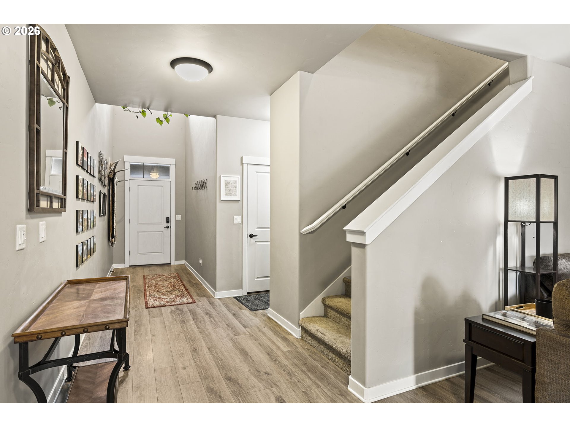 60439 Hedgewood Lane Bend, OR 97702 - Photo 36 of 44 a view of a hallway with wooden floor and staircase