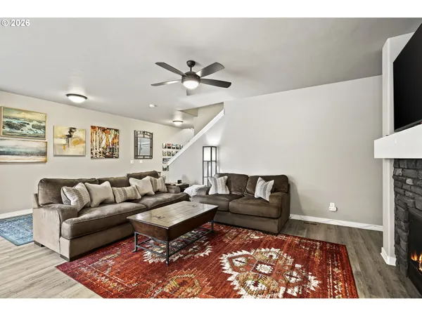 a living room with furniture and a rug
