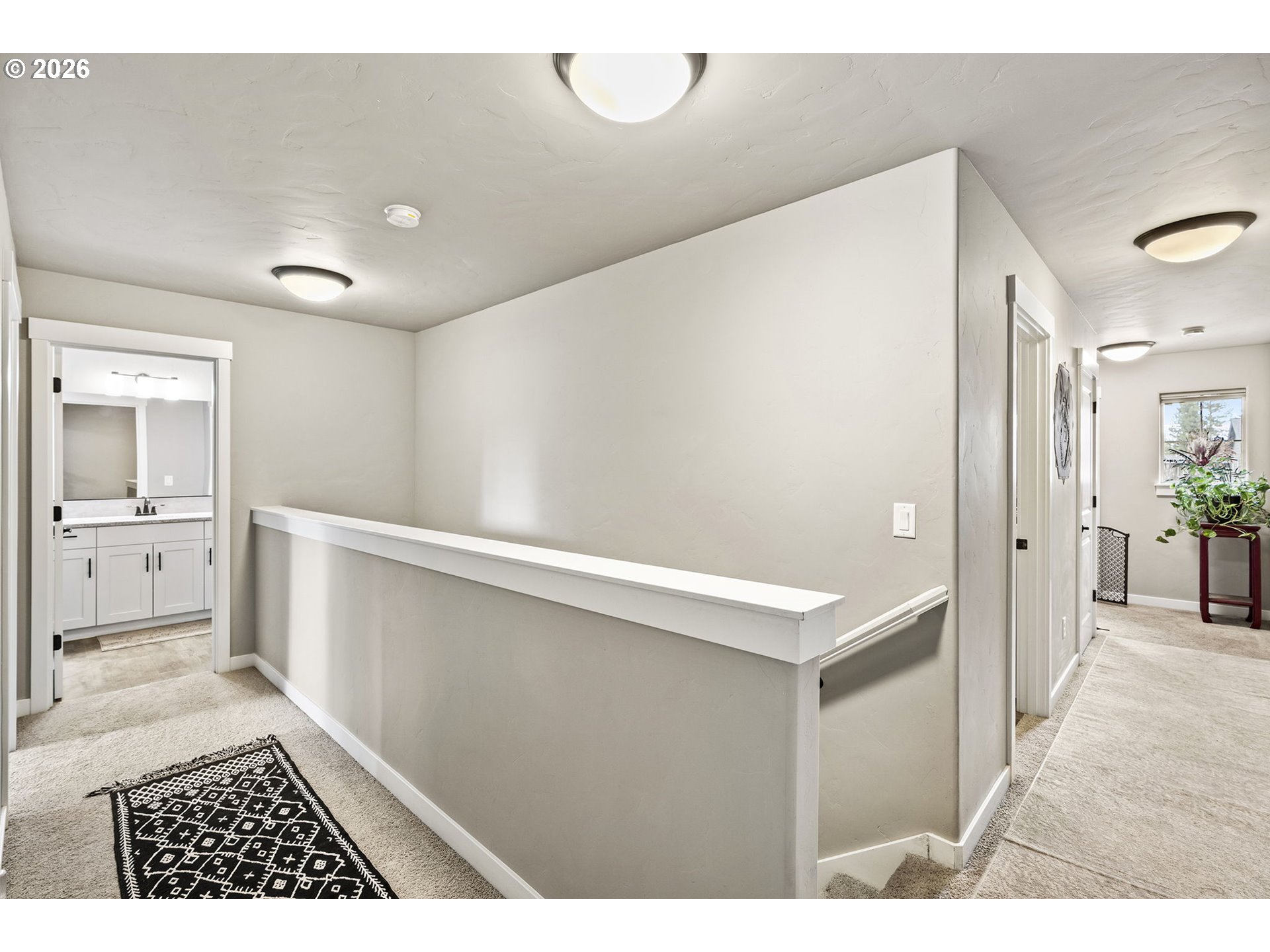 60439 Hedgewood Lane Bend, OR 97702 - Photo 10 of 44 a view of a hallway with bathroom