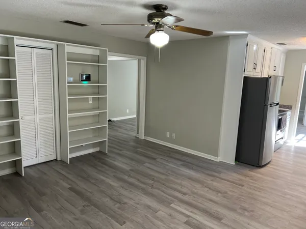 a view of an empty room with a window