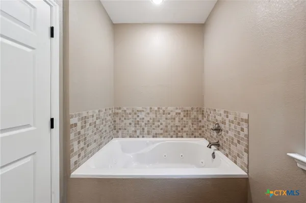a bathroom with a bathtub