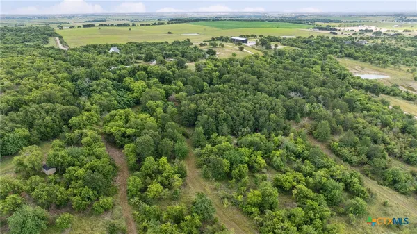 a view of a field with an outdoor space