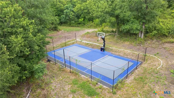 a view of a small pool with a yard