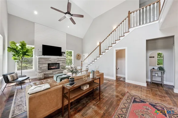 a living room with furniture and a flat screen tv