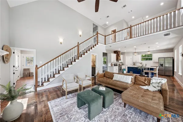 a living room with furniture or wooden floor and a potted plant
