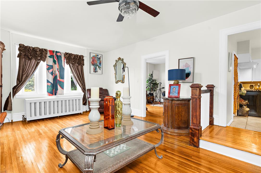 2055 Ferry Street Wilson, PA 18042 - Photo 4 of 21 This living room features gleaming wood floors and ample natural light, creating an inviting atmosphere.