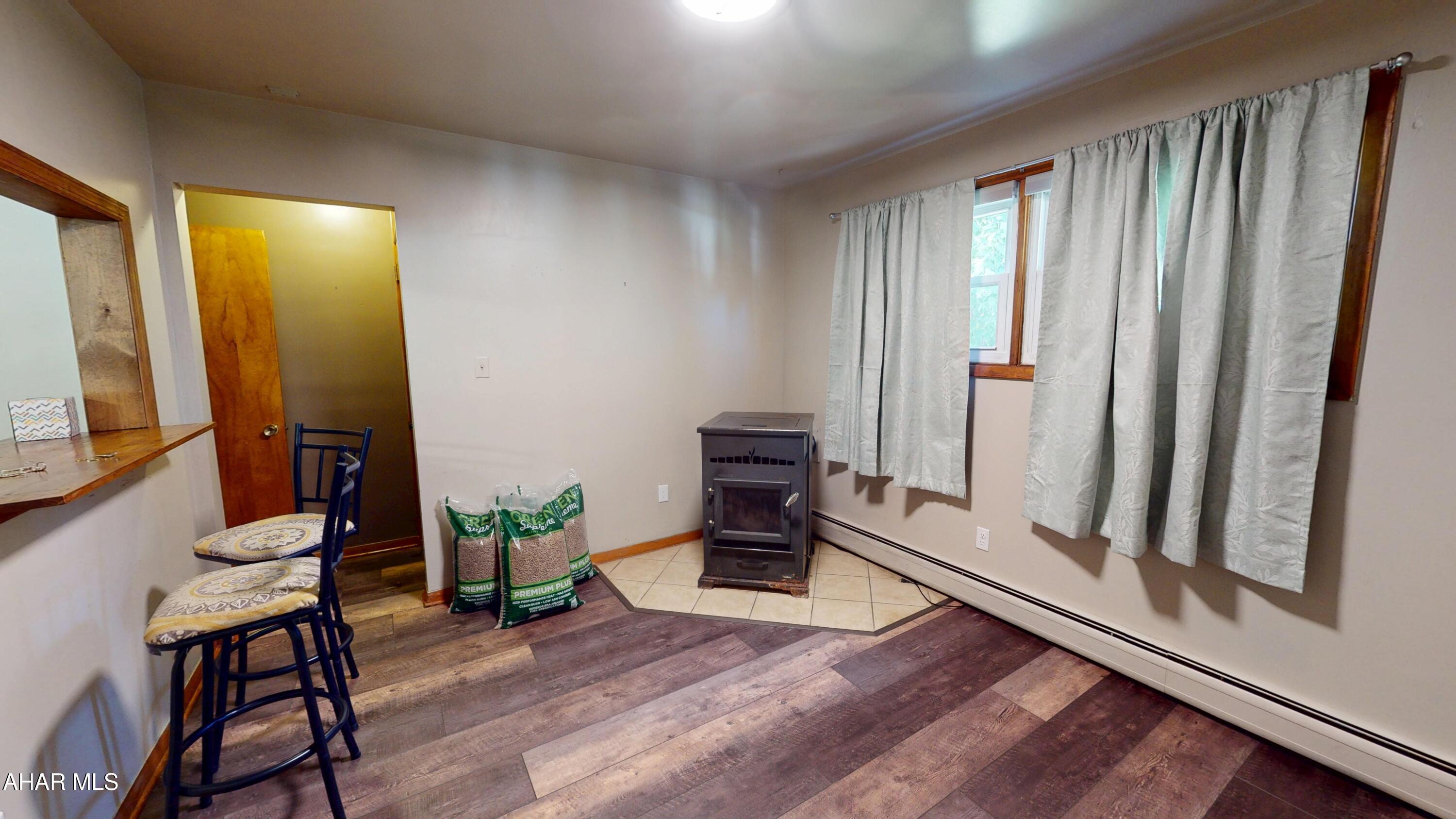 871 Decker Hollow Road Tyrone, PA 16686 - Photo 17 of 35 a living room with furniture and a fireplace