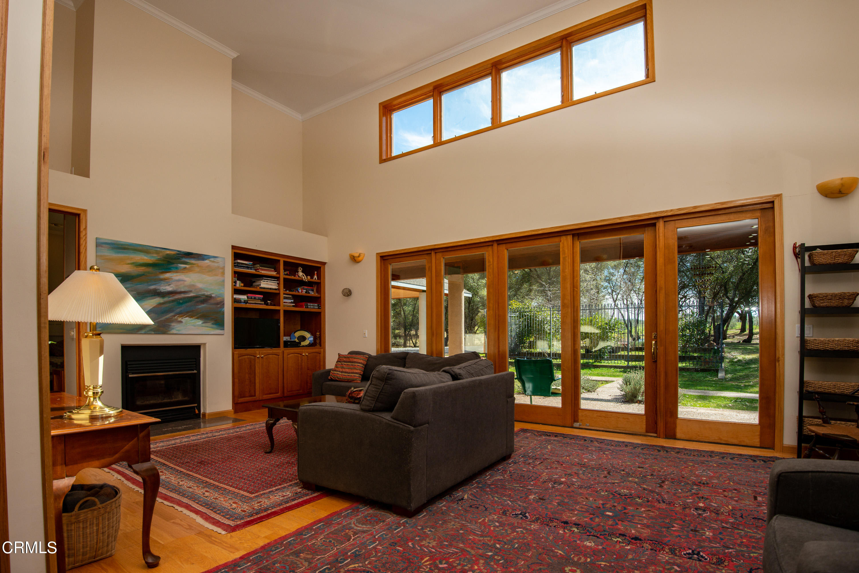 4000 Twin Ridges Road Garden Valley, CA 95633 - Photo 4 of 17 a living room with furniture a large window and a fireplace