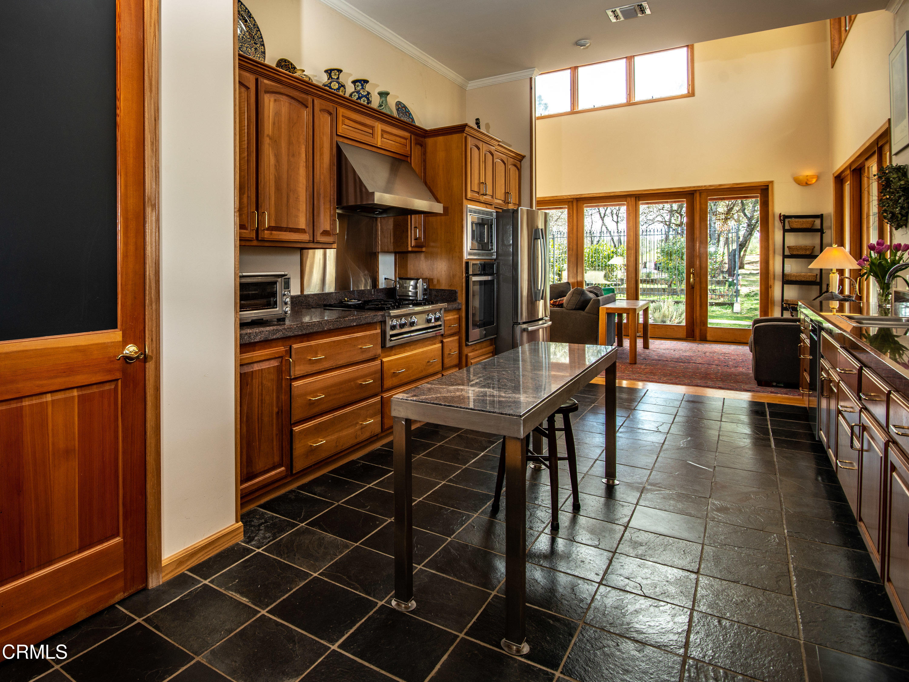 4000 Twin Ridges Road Garden Valley, CA 95633 - Photo 6 of 17 a dining hall with stainless steel appliances a stove a sink and a refrigerator