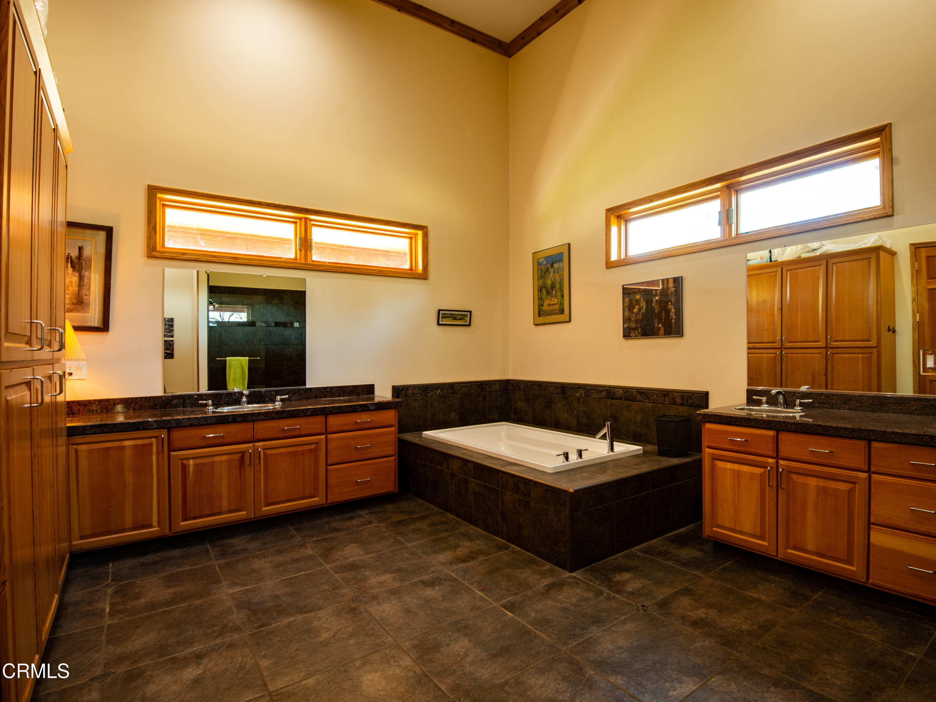 4000 Twin Ridges Road Garden Valley, CA 95633 - Photo 10 of 17 a large bathroom with a tub a double vanity sink a mirror and a bathtub