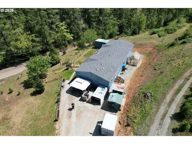 a aerial view of a house with a yard
