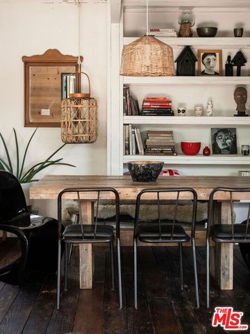 a kitchen with a table and chairs in it
