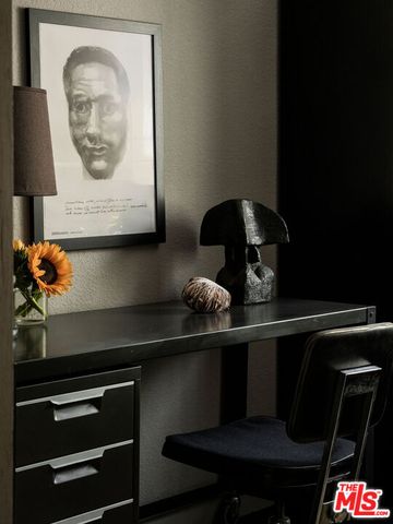 a bedroom with a bed and a potted plant