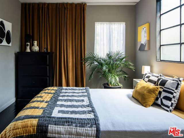 a living room with furniture fireplace and a window