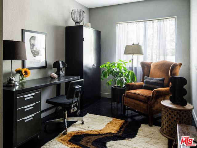 a dining room with a table and chairs