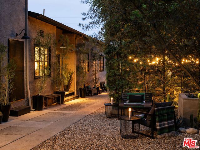 a view of a building with sitting area