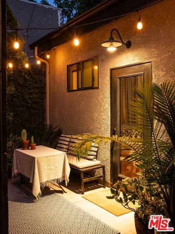 a kitchen with stainless steel appliances granite countertop a stove top oven a sink and cabinets