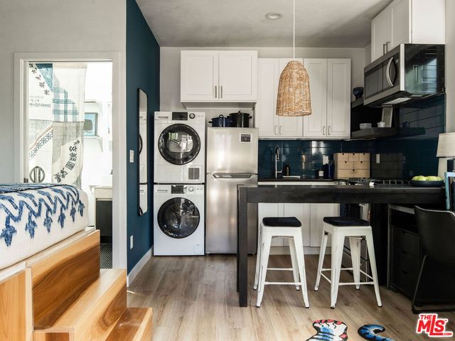 a bedroom with bed and a window