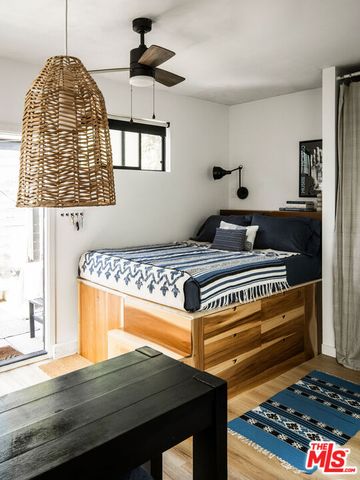 a kitchen with a stove a refrigerator and a sink