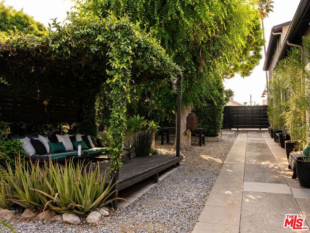 a green bench sitting in a yard
