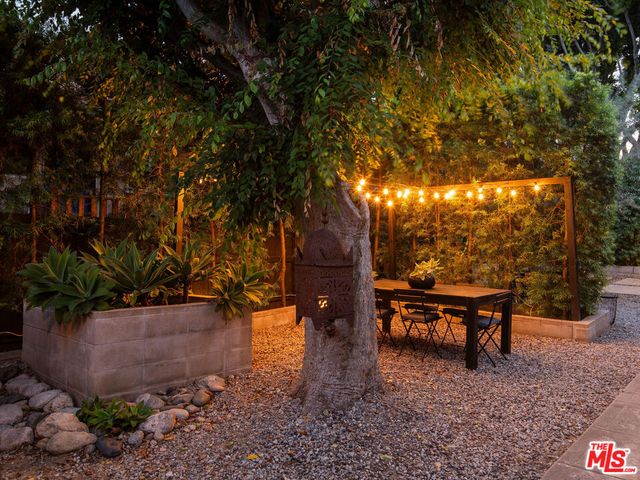 a view of a house with a wooden fence