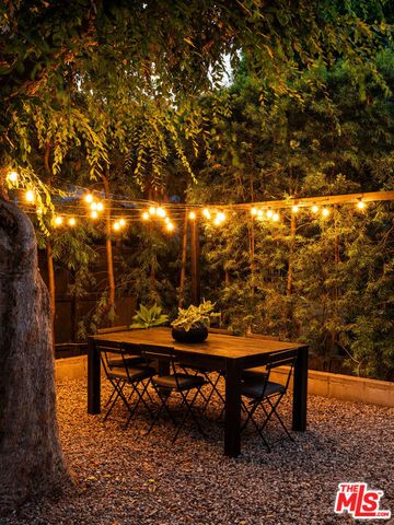 a view of a house with a tree