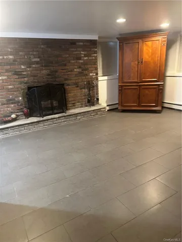 an empty room with fireplace