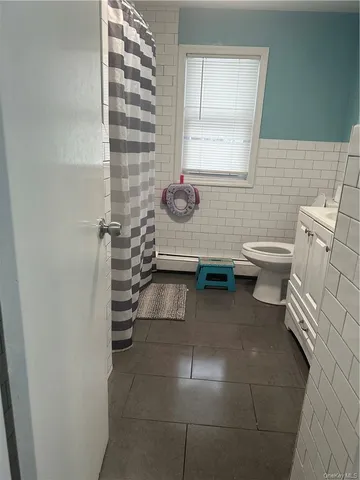 a bathroom with a toilet and a sink