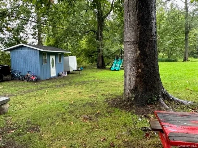 a backyard of a house with lots of green space