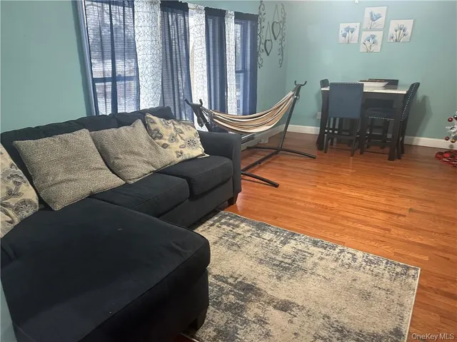 a outdoor living space with furniture and a rug