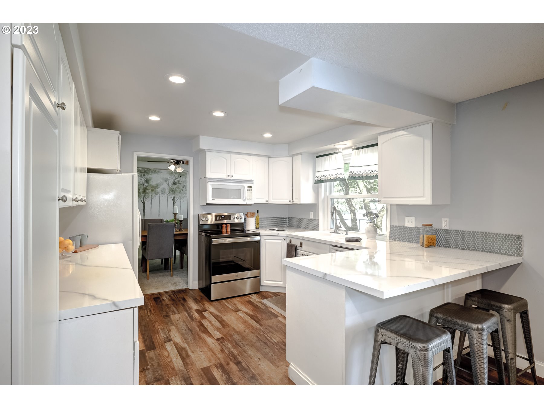 20430 Southwest Avon Court Beaverton, OR 97078 - Photo 12 of 29 a kitchen with refrigerator cabinets and a sink