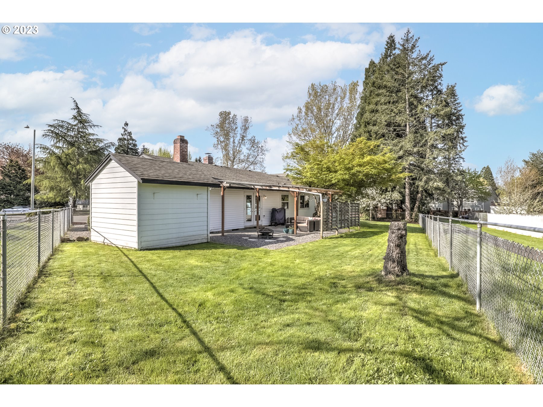 20430 Southwest Avon Court Beaverton, OR 97078 - Photo 26 of 29 a swimming pool with big yard and large trees