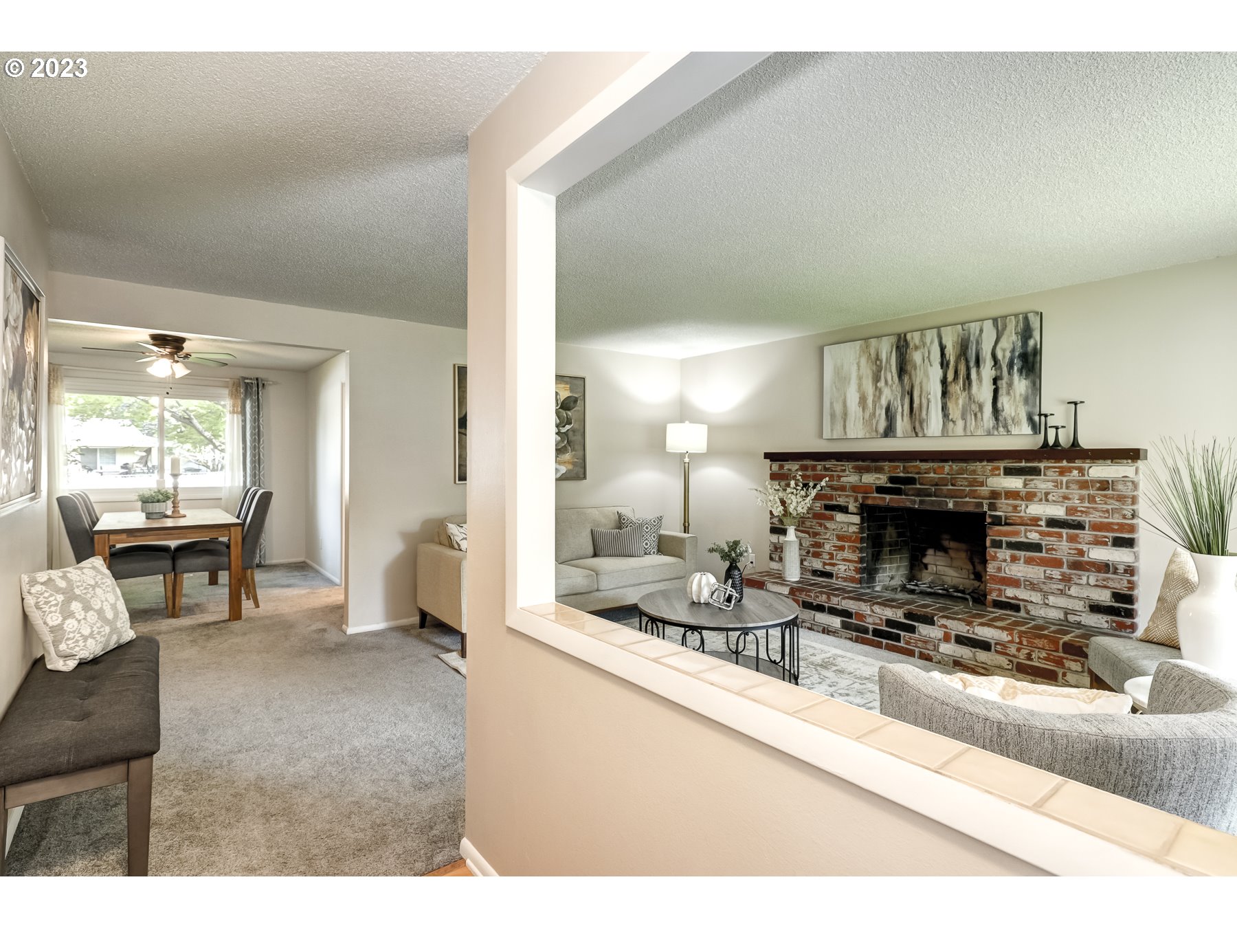 20430 Southwest Avon Court Beaverton, OR 97078 - Photo 4 of 29 a living room with furniture and a fireplace