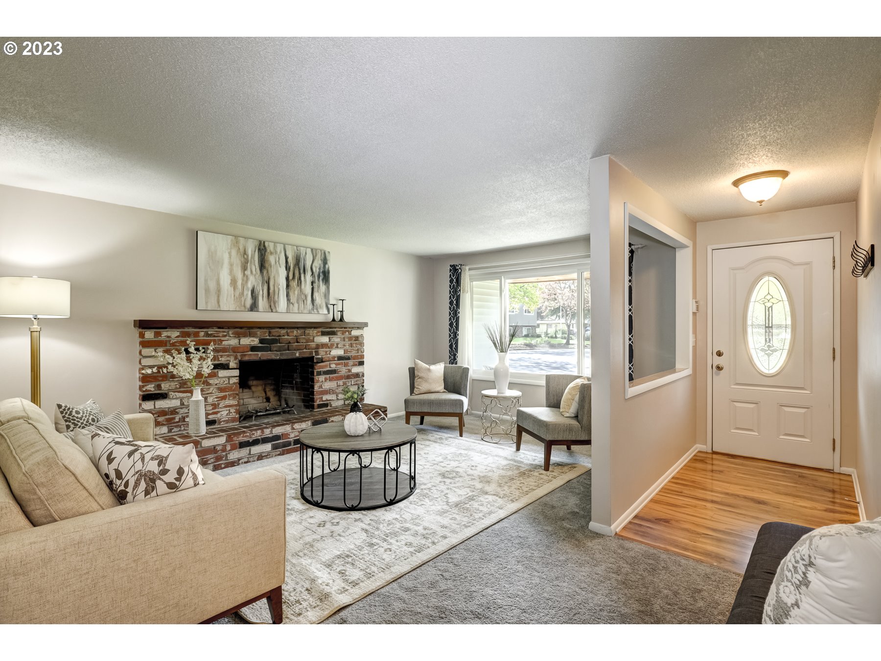 20430 Southwest Avon Court Beaverton, OR 97078 - Photo 5 of 29 a living room with furniture and a fireplace