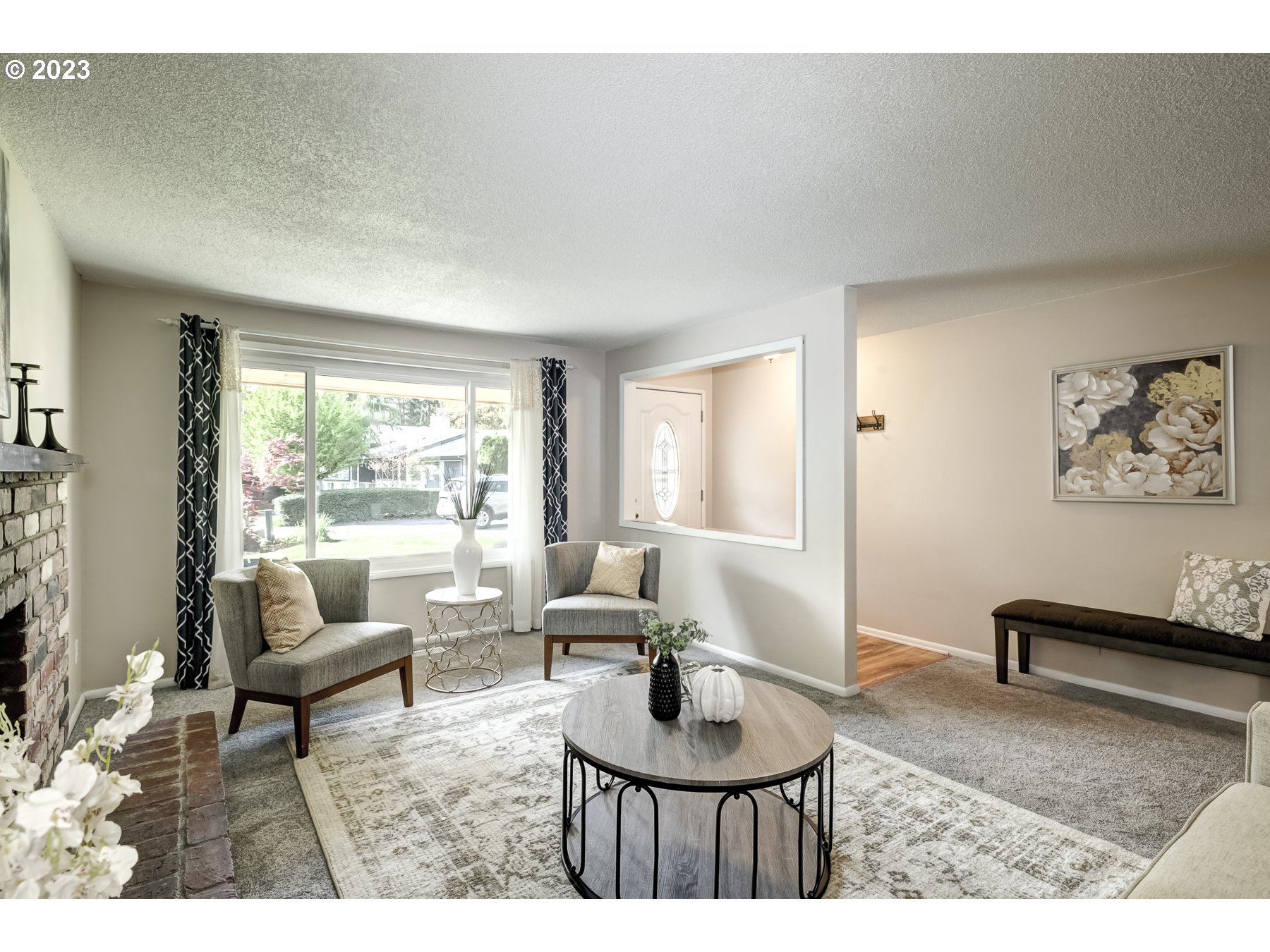 20430 Southwest Avon Court Beaverton, OR 97078 - Photo 6 of 29 a living room with furniture and a large window