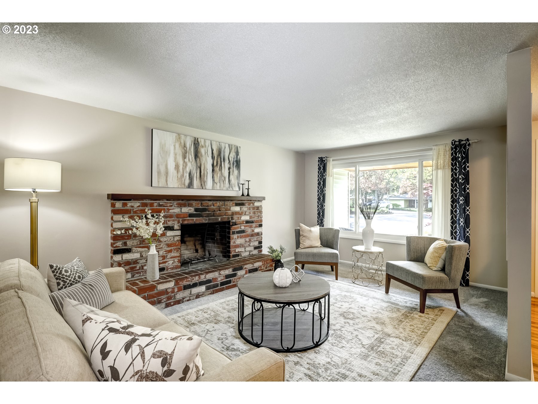 20430 Southwest Avon Court Beaverton, OR 97078 - Photo 7 of 29 a living room with furniture and a fireplace