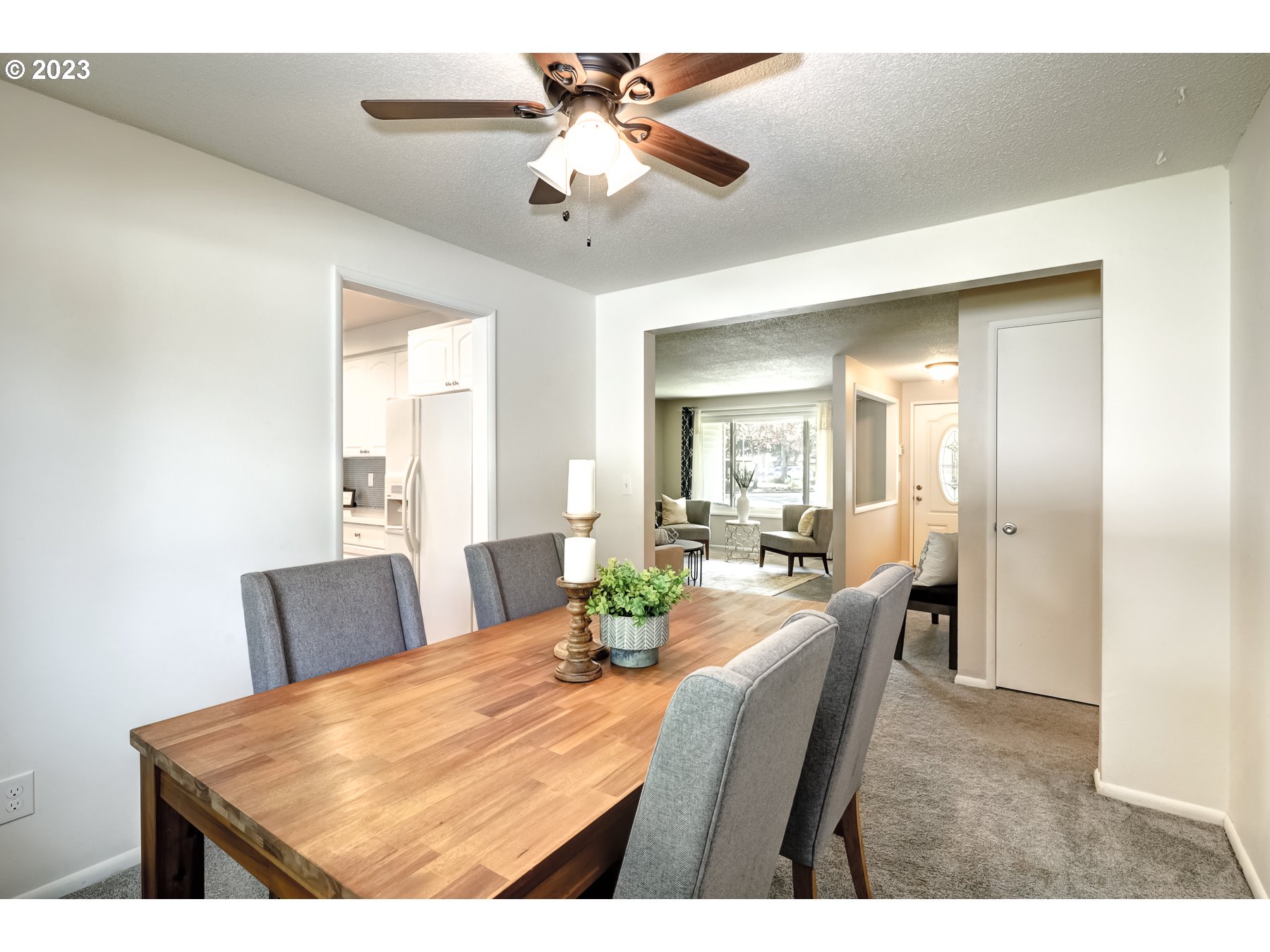 20430 Southwest Avon Court Beaverton, OR 97078 - Photo 10 of 29 a view of a dining room with furniture and a chandelier