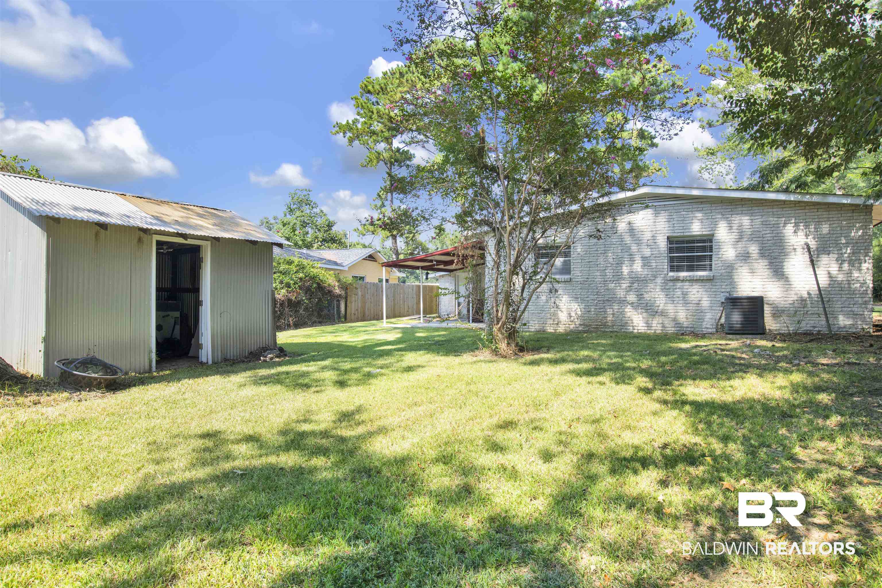 2 Lee Circle Daphne, AL 36527 - Photo 18 of 21 View of yard featuring central air condition unit and an outbuilding