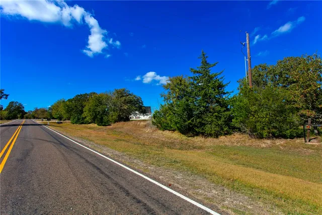 a view of a yard next to a building