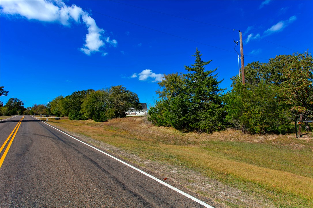 10479 Steep Hollow Road Bryan, TX 77808 - Photo 6 of 6 a view of a yard next to a building