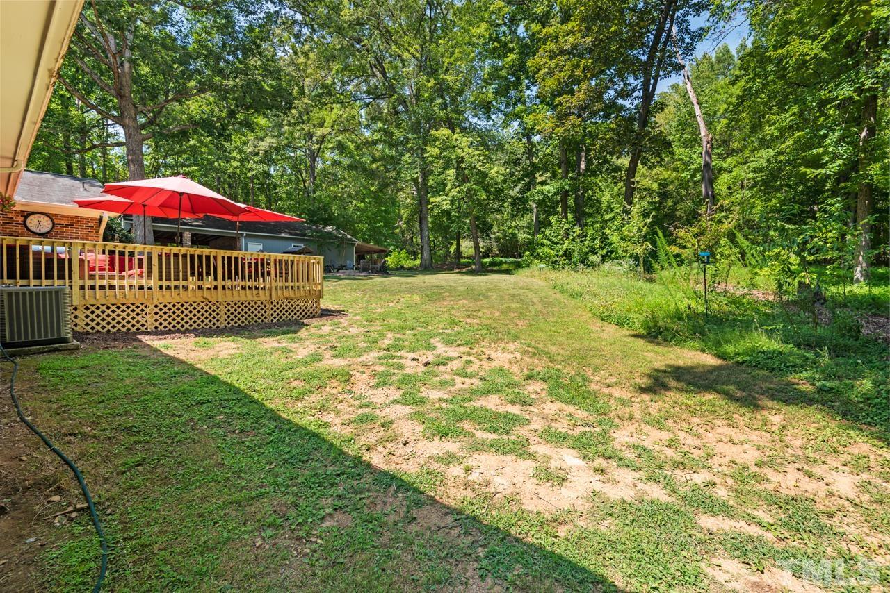 8201 Bromley Road Hillsborough, NC 27278 - Photo 43 of 77 a view of a back yard of the house