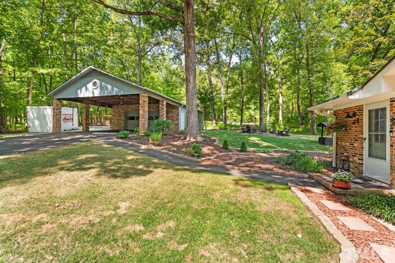8201 Bromley Road Hillsborough, NC 27278 - Photo 50 of 77 a view of a house with a yard