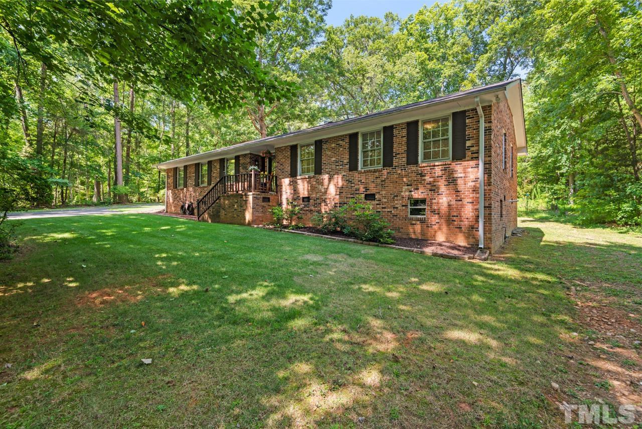 8201 Bromley Road Hillsborough, NC 27278 - Photo 63 of 77 a view of a house with backyard and garden