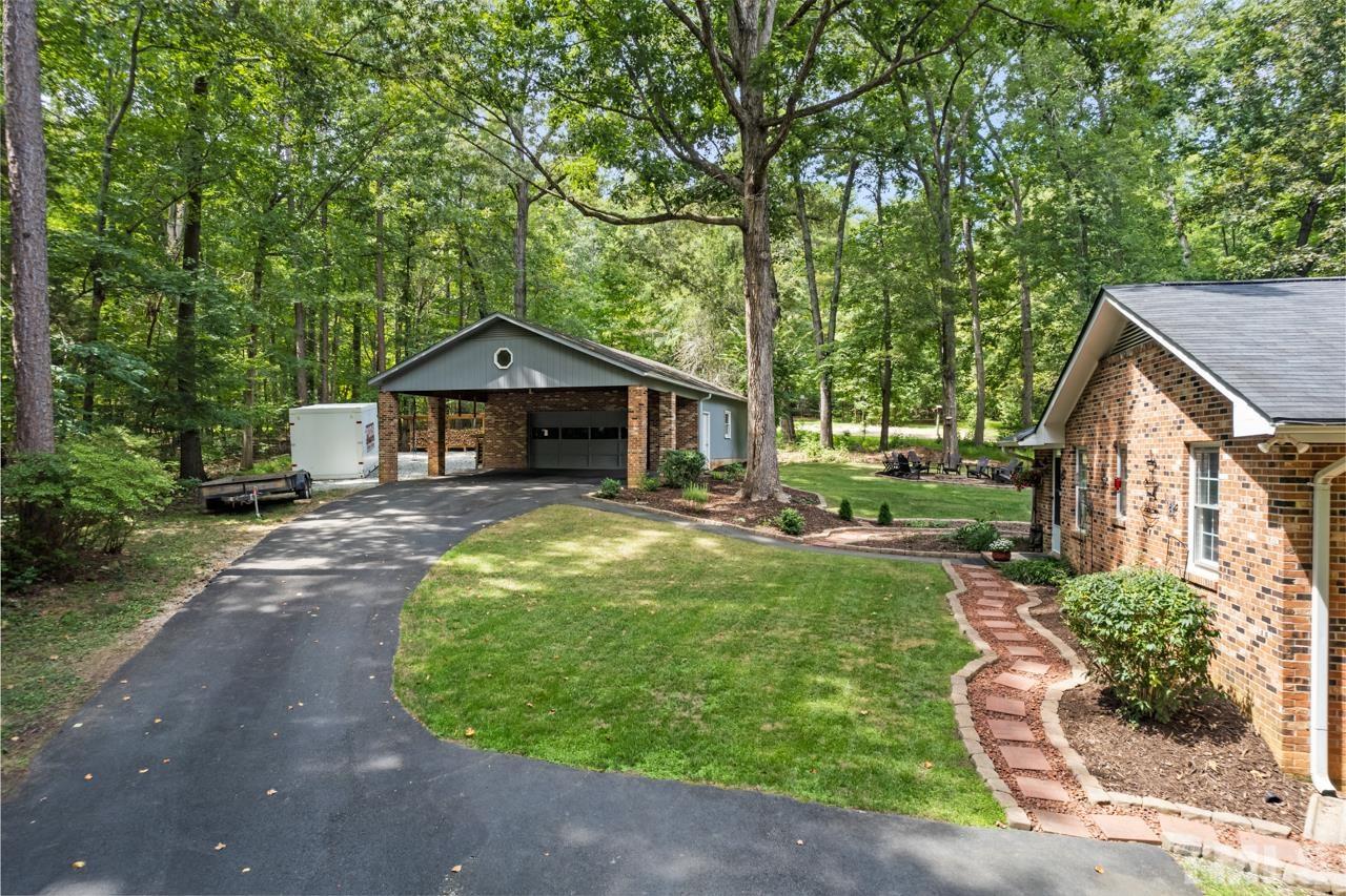 8201 Bromley Road Hillsborough, NC 27278 - Photo 66 of 77 a front view of a house with garden
