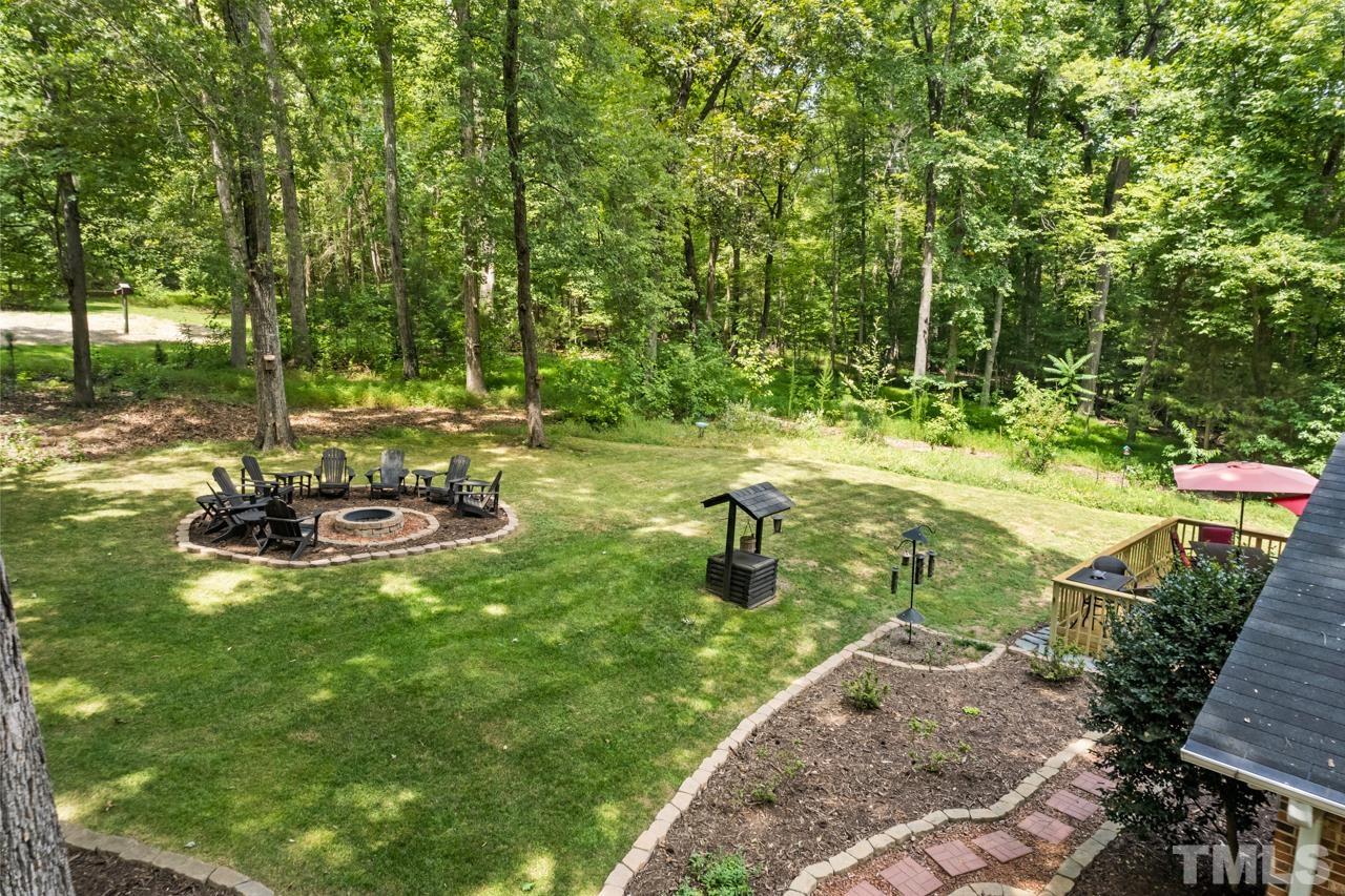 8201 Bromley Road Hillsborough, NC 27278 - Photo 69 of 77 a view of a backyard with large trees