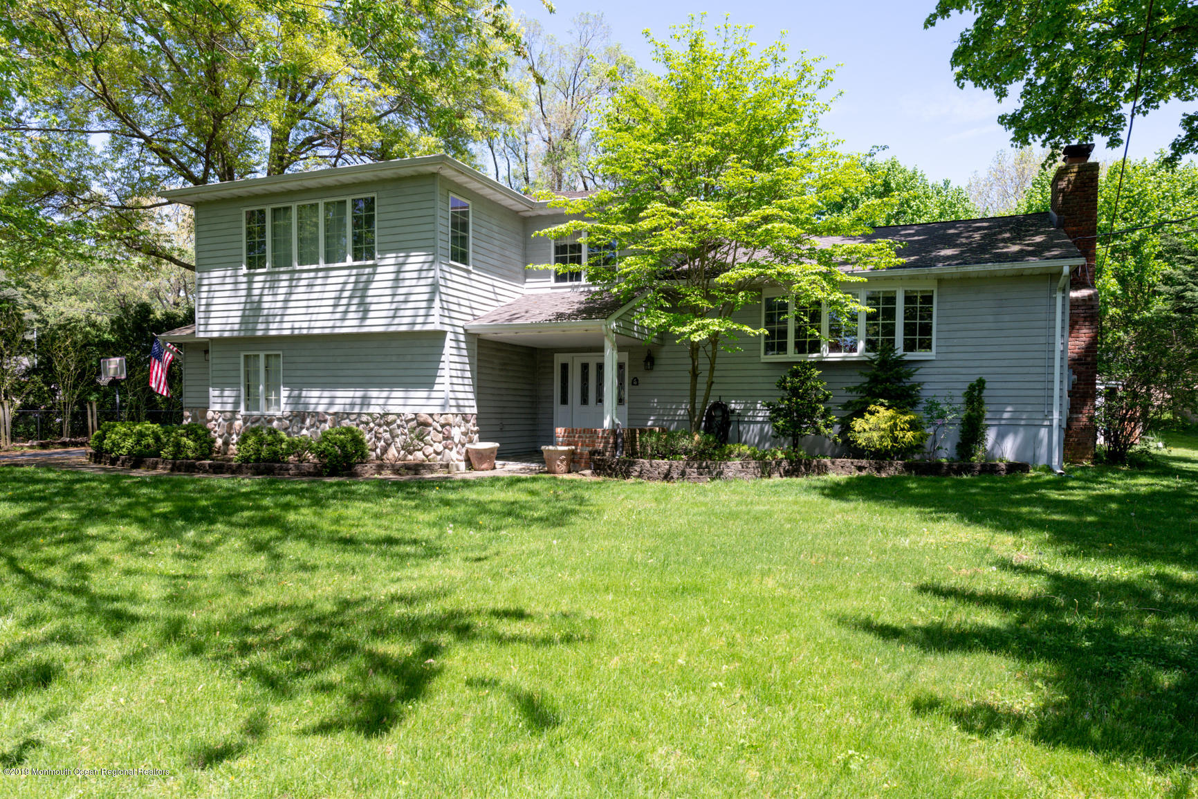 10 Gull Road Middletown, NJ 07748 - Photo 1 of 18 a front view of a house with a garden