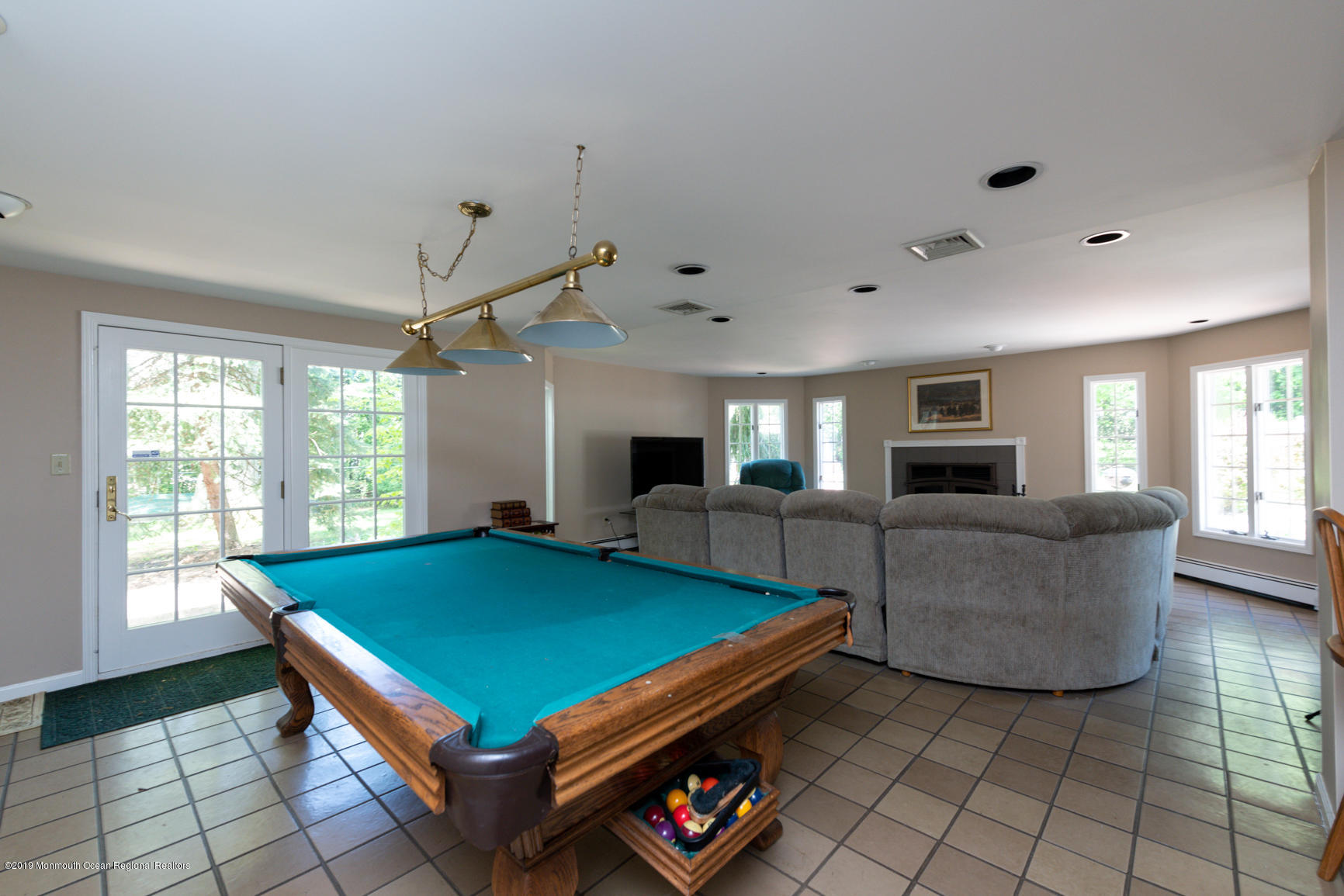 10 Gull Road Middletown, NJ 07748 - Photo 13 of 18 a living room with furniture pool table and flat screen tv
