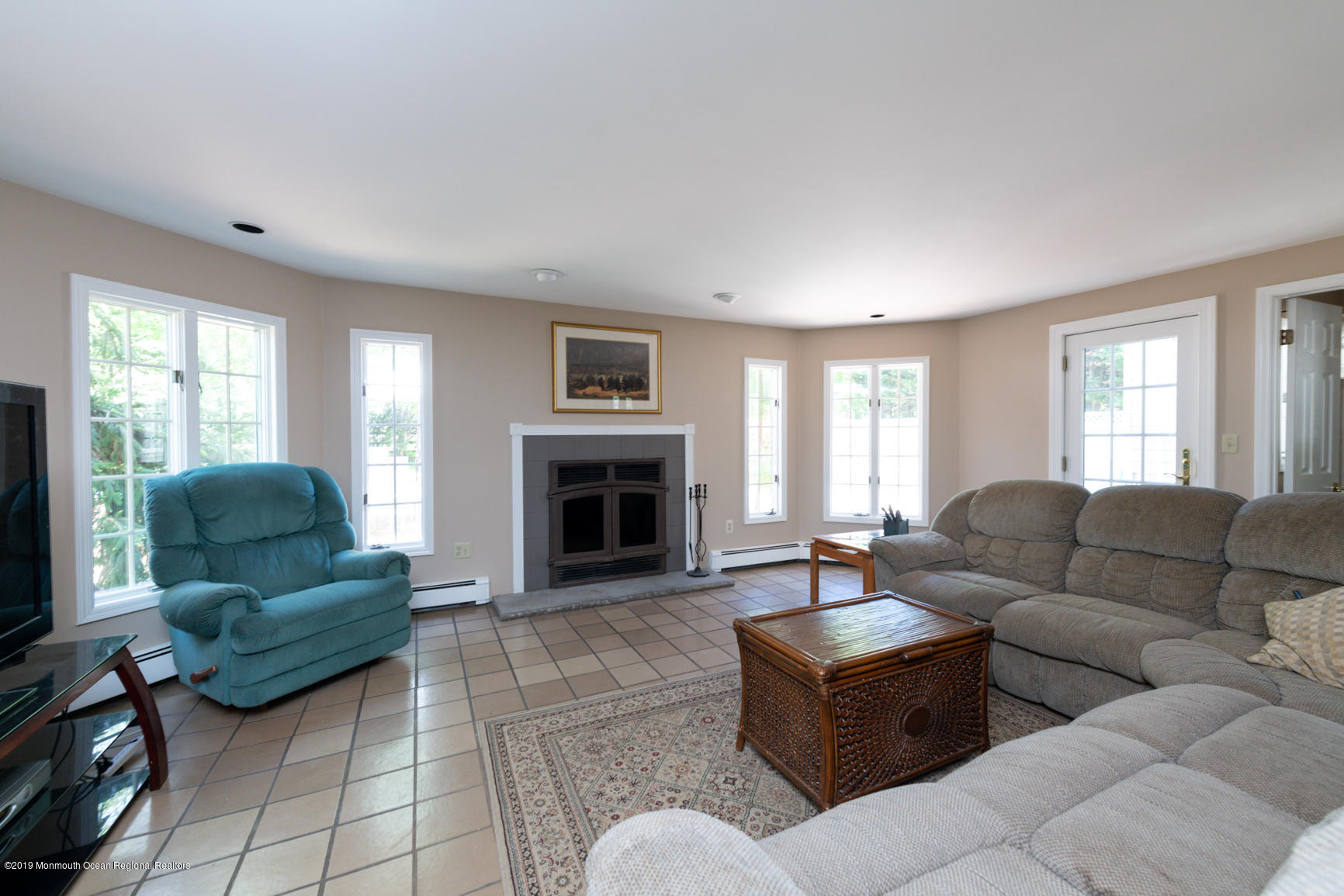 10 Gull Road Middletown, NJ 07748 - Photo 14 of 18 a living room with furniture and a fireplace