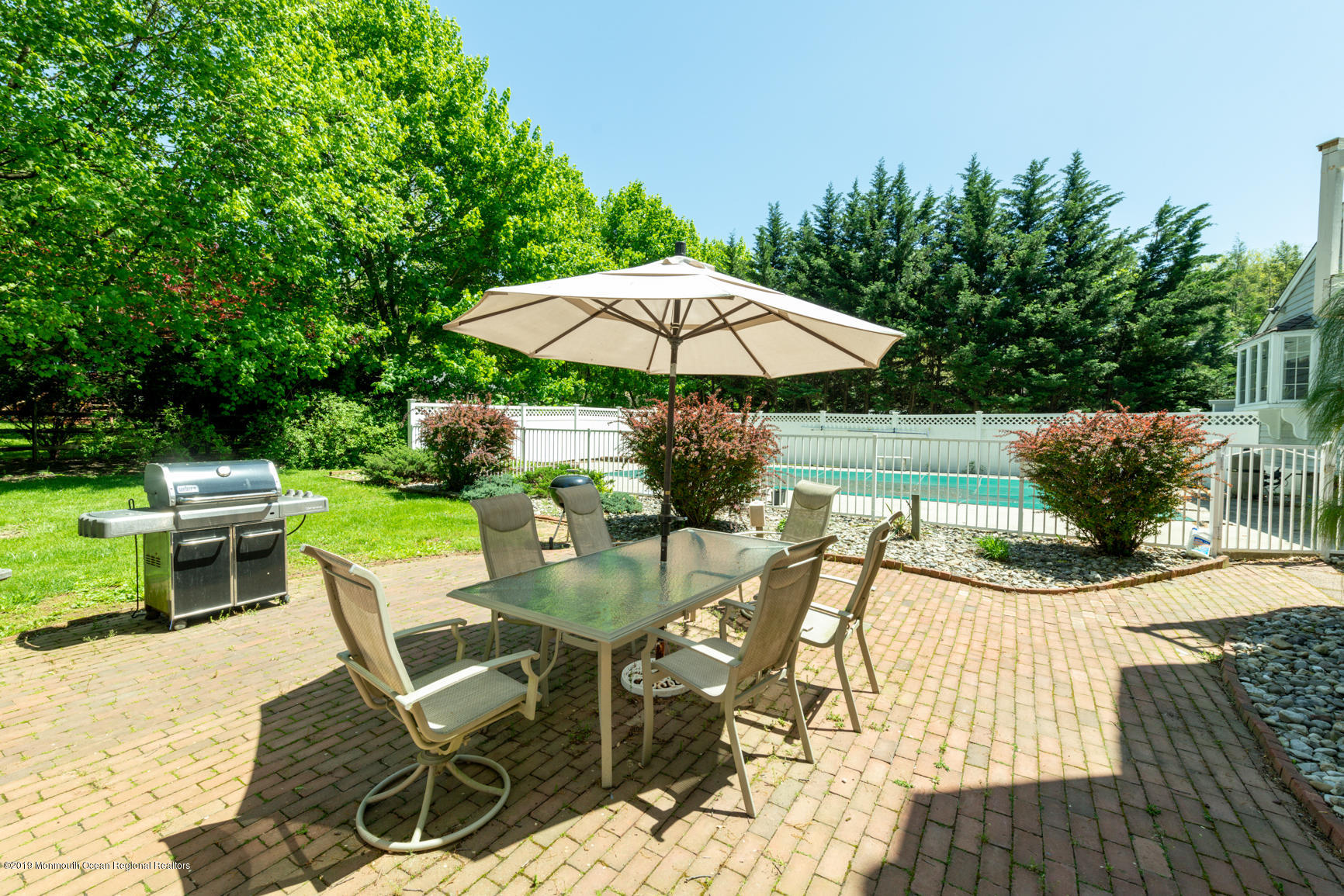 10 Gull Road Middletown, NJ 07748 - Photo 3 of 18 a view of a backyard with furniture and a garden
