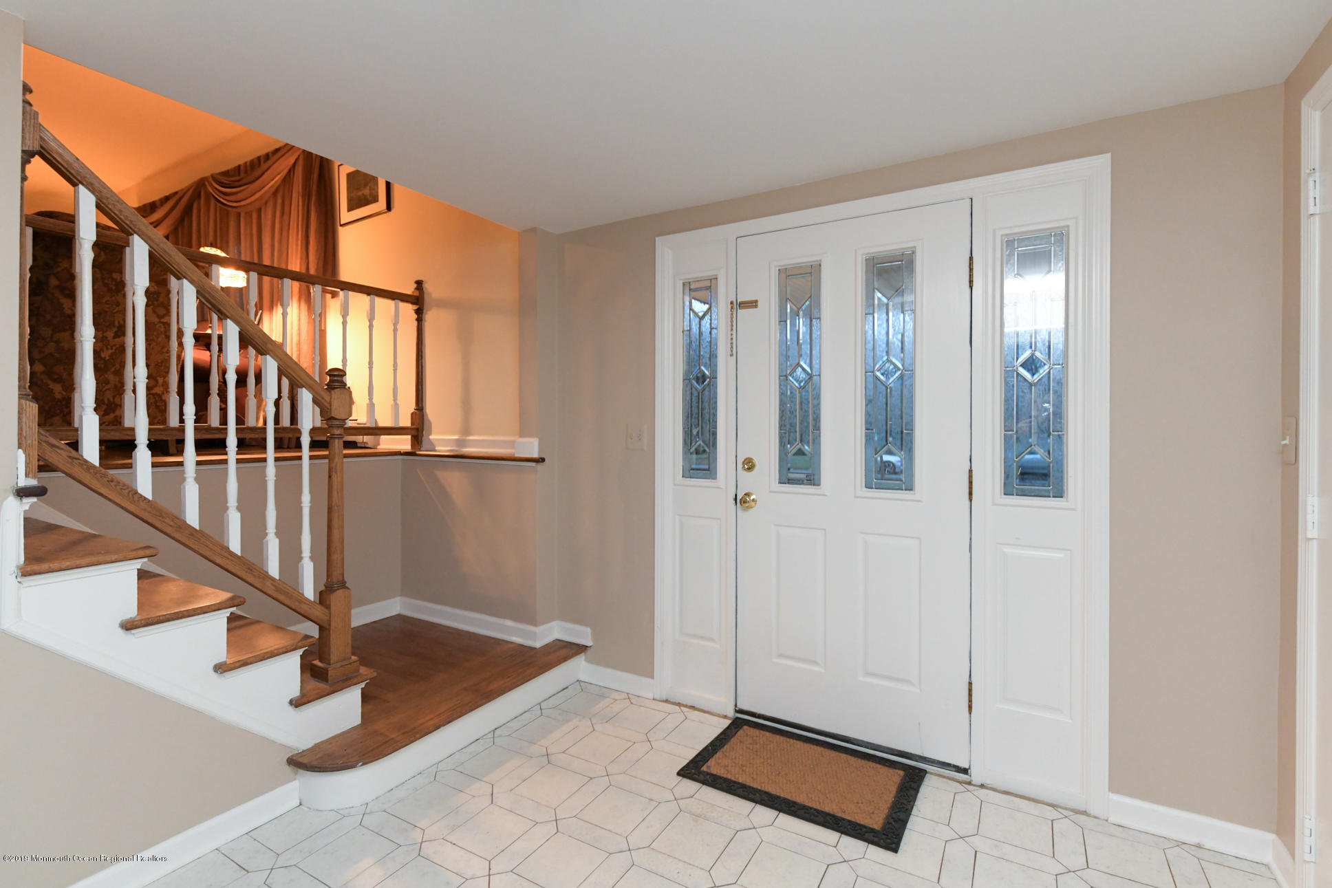 10 Gull Road Middletown, NJ 07748 - Photo 4 of 18 a view of an entryway with staircase